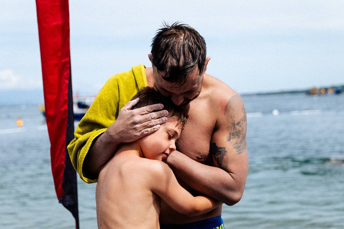 Neil with son Jack after his final challenge swim
