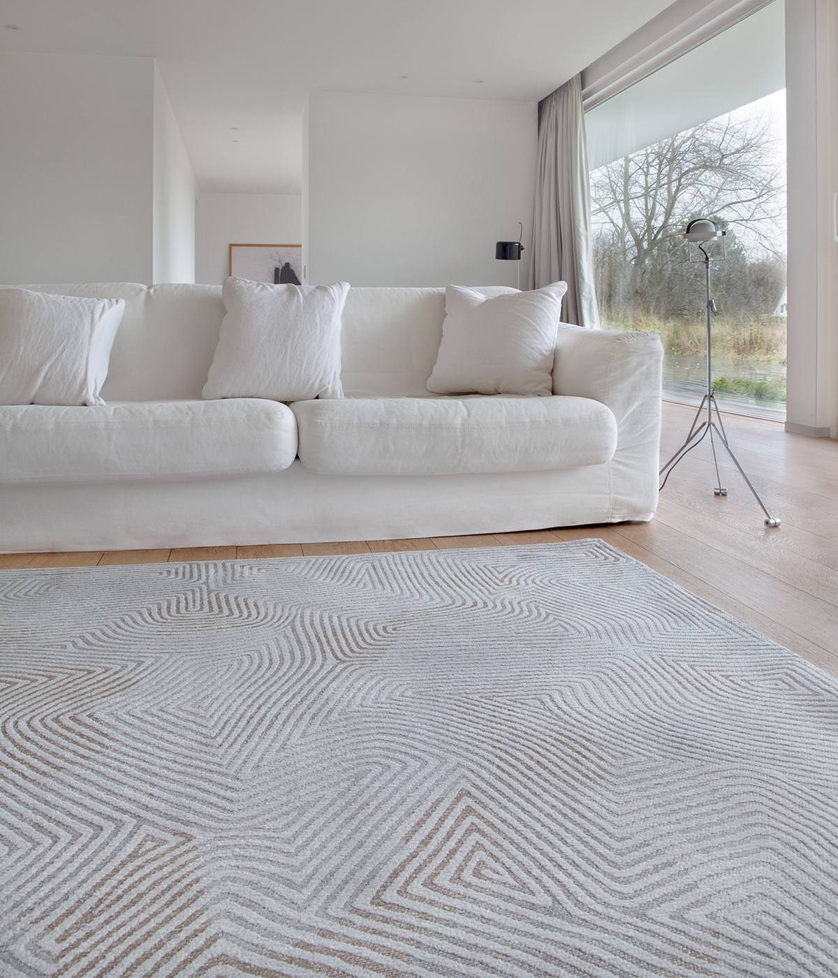 Warm winter white interior featuring pale flooring, soft cream tones and natural textures for a cosy, contemporary home.