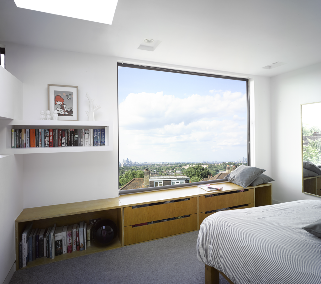 Picture window with a scenic view of a sunny city